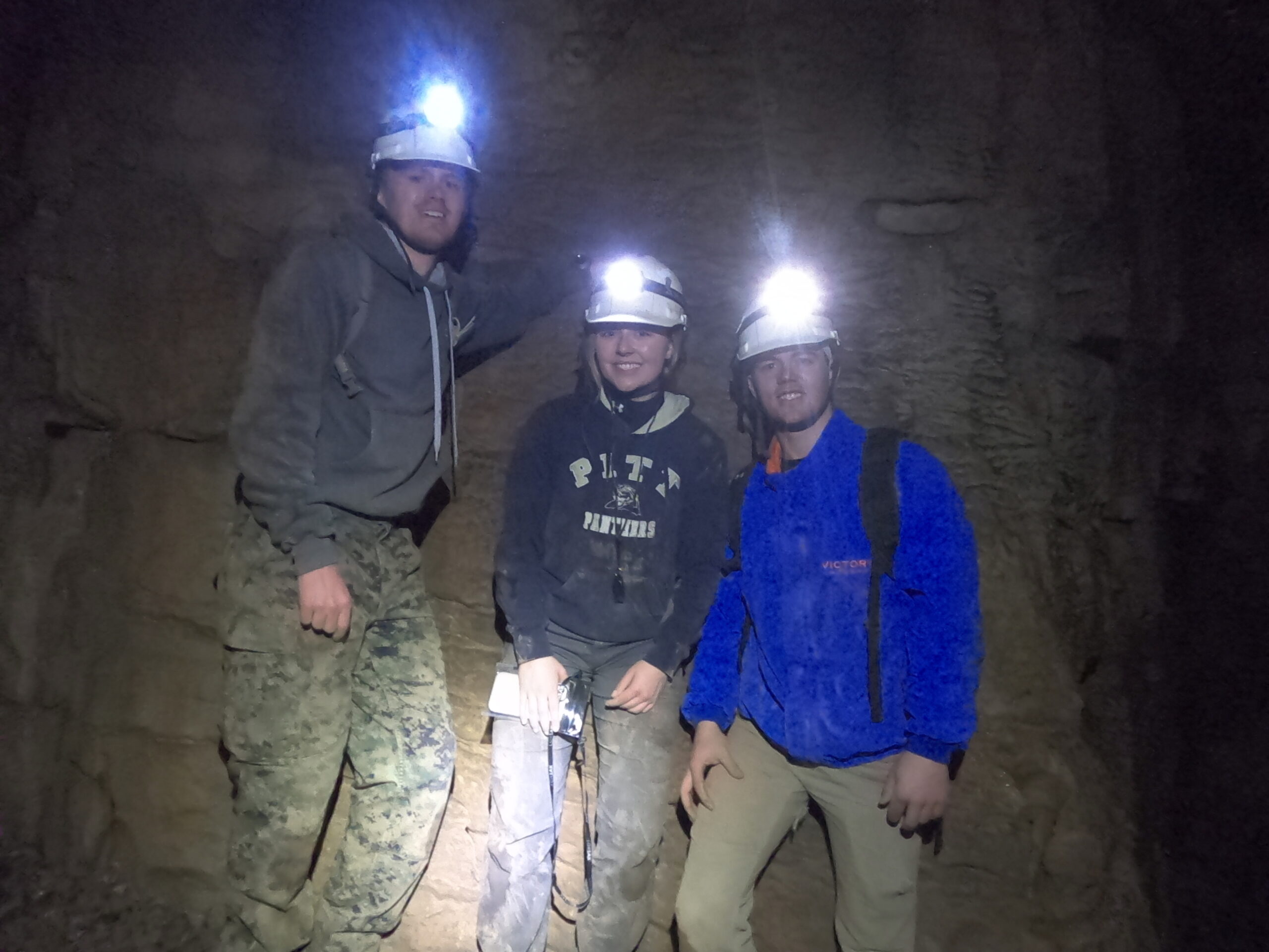The team inside of the cave system exploring.